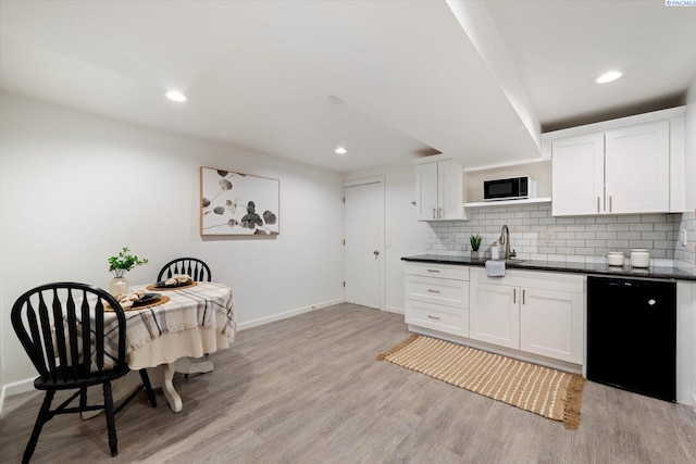 2115 W 8th Pl, Kennewick, WA 99336 - kitchen featuring black appliances, dark countertops, baseboards, and recessed lighting