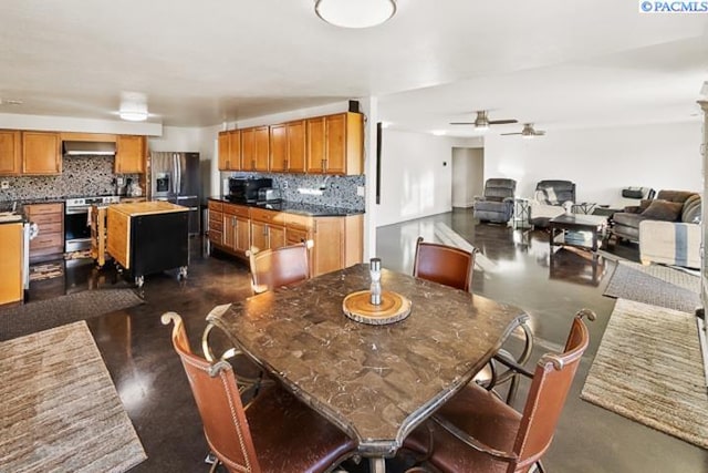 dining room featuring ceiling fan