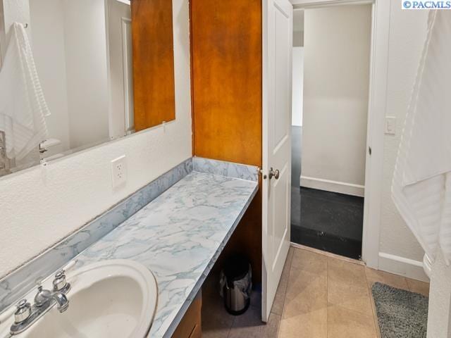 bathroom featuring vanity and tile patterned flooring