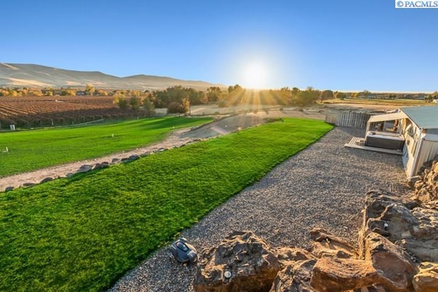 view of yard featuring a mountain view and a rural view