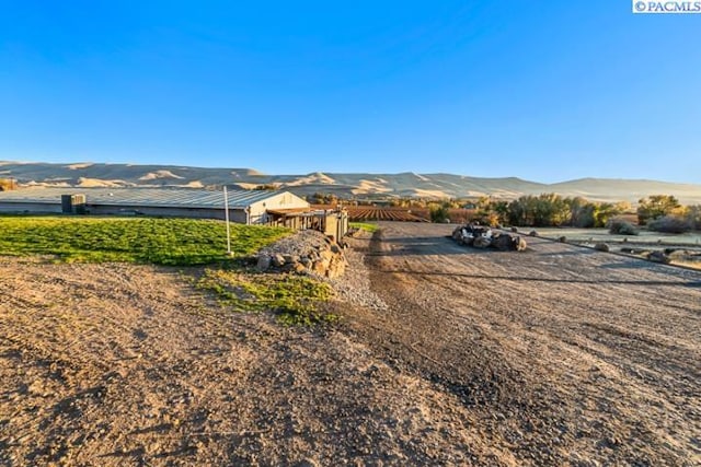 view of mountain feature featuring a rural view