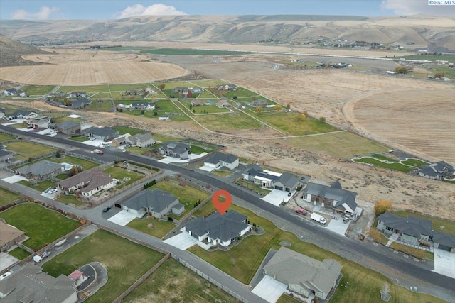 birds eye view of property featuring a mountain view