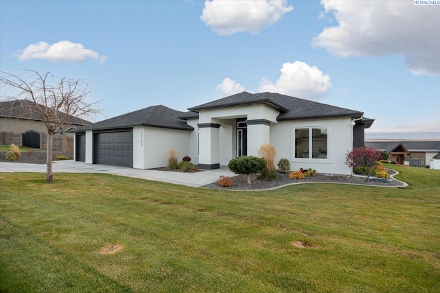 prairie-style house with a garage and a front yard