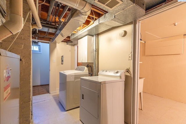 laundry room featuring independent washer and dryer