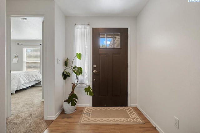 2909 S Jean St, Kennewick, WA 99336 - foyer entrance with baseboards and wood finished floors