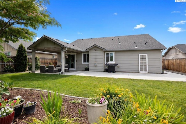 2909 S Jean St, Kennewick, WA 99336 - rear view of house featuring a patio, a fenced backyard, and an outdoor living space