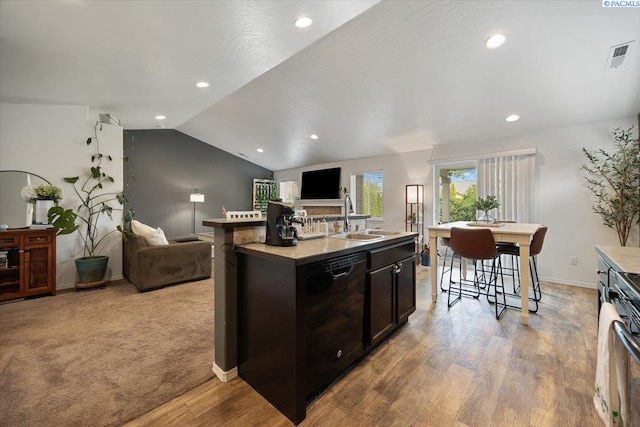 2909 S Jean St, Kennewick, WA 99336 - kitchen with black dishwasher, open floor plan, light wood finished floors, recessed lighting, and light countertops
