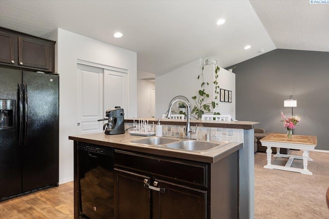 2909 S Jean St, Kennewick, WA 99336 - kitchen with black appliances, a kitchen island with sink, dark brown cabinets, vaulted ceiling, and recessed lighting