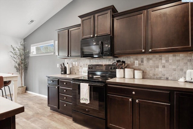 2909 S Jean St, Kennewick, WA 99336 - kitchen with black appliances, lofted ceiling, backsplash, dark brown cabinetry, and light countertops
