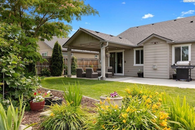 2909 S Jean St, Kennewick, WA 99336 - rear view of house with a patio area, an outdoor hangout area, roof with shingles, and board and batten siding