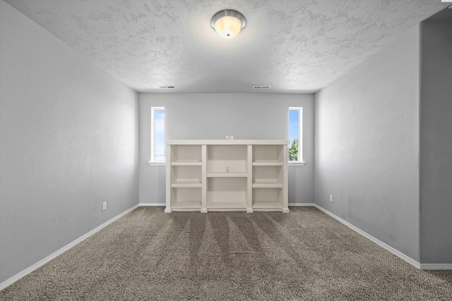 874 Pikes Peak Dr, West Richland, WA 99353 - unfurnished bedroom featuring carpet floors, a textured ceiling, and baseboards
