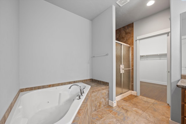 874 Pikes Peak Dr, West Richland, WA 99353 - bathroom with a shower stall, a whirlpool tub, and a walk in closet
