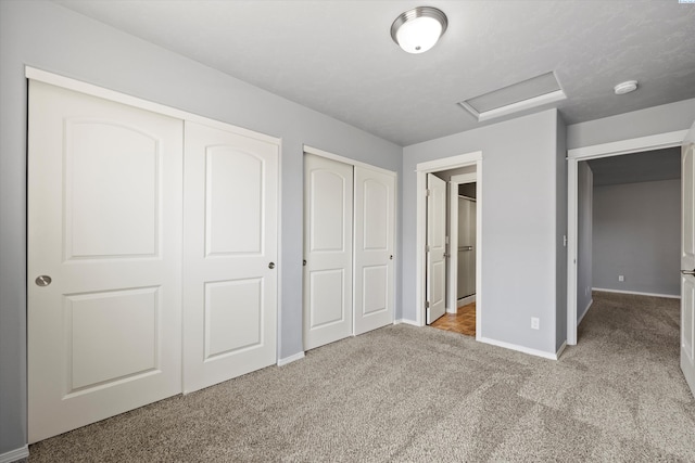 874 Pikes Peak Dr, West Richland, WA 99353 - unfurnished bedroom with attic access, carpet, two closets, and baseboards