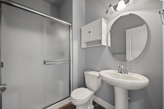 874 Pikes Peak Dr, West Richland, WA 99353 - bathroom with a stall shower, toilet, and baseboards