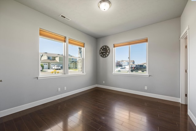 874 Pikes Peak Dr, West Richland, WA 99353 - spare room with baseboards and dark wood-style floors