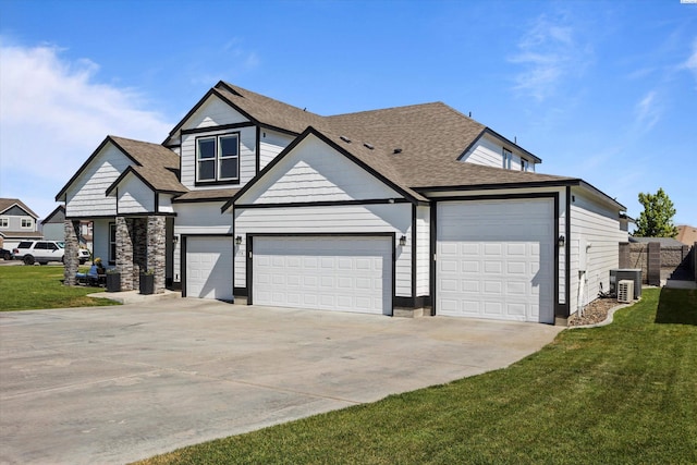 874 Pikes Peak Dr, West Richland, WA 99353 - view of front facade with concrete driveway, a shingled roof, central air condition unit, and a front yard