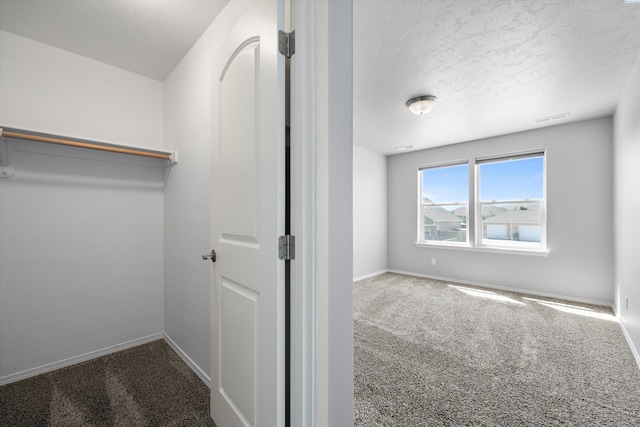 874 Pikes Peak Dr, West Richland, WA 99353 - spacious closet featuring carpet floors