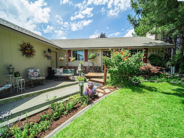 902 W 44th Pl, Kennewick, WA 99337 - rear view of house featuring a yard, a patio, a chimney, and a deck