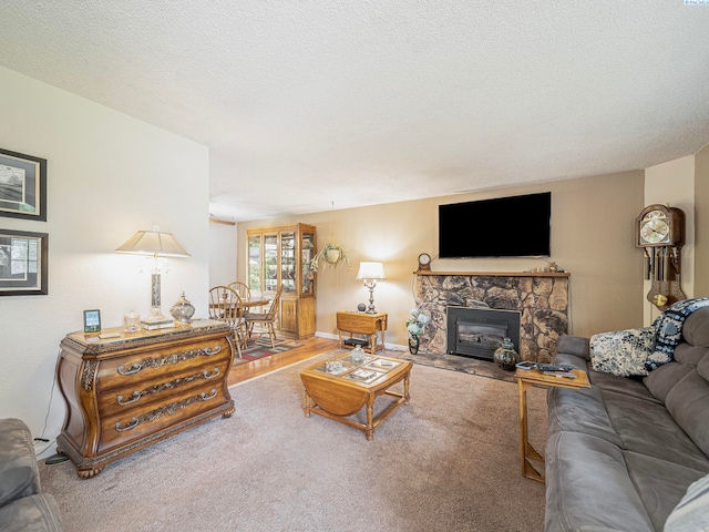 902 W 44th Pl, Kennewick, WA 99337 - living area featuring carpet floors, a fireplace, and a textured ceiling