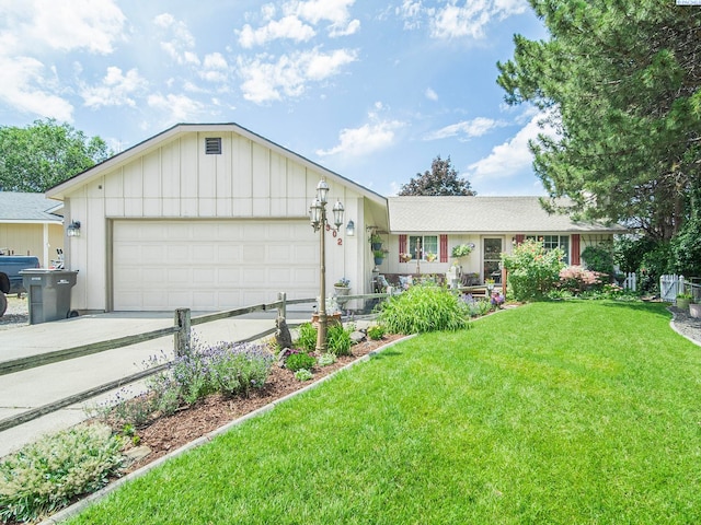 902 W 44th Pl, Kennewick, WA 99337 - single story home with a garage, driveway, and board and batten siding