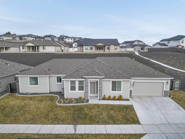 view of front of property featuring a shingled roof, a residential view, stone siding, and concrete driveway