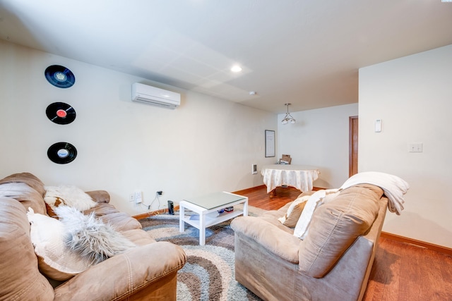 815 NE Illinois St, Pullman, WA 99163 - living room featuring a wall mounted air conditioner, baseboards, and wood finished floors