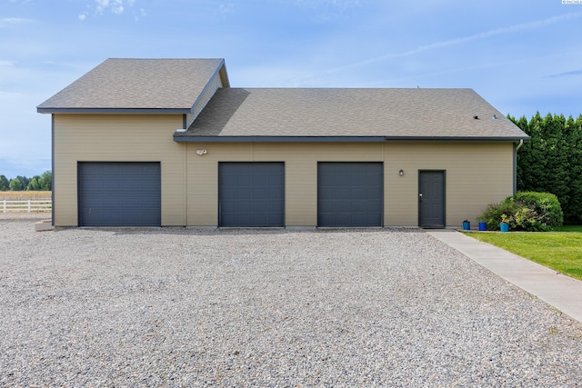 garage with fence