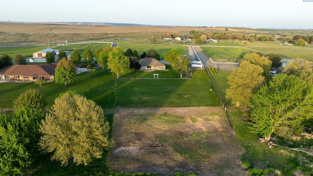 birds eye view of property with a rural view