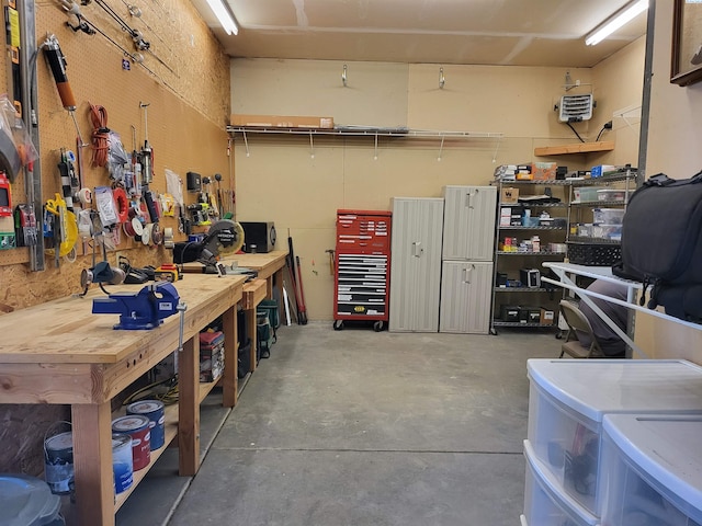 garage featuring independent washer and dryer and a workshop area