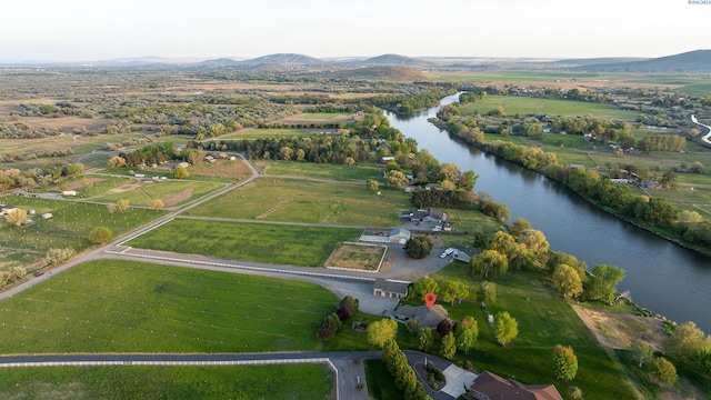 bird's eye view with a rural view and a water and mountain view