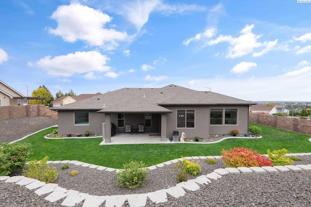 325 Soaring Hawk, Richland, WA 99352 - back of property featuring a patio area, a shingled roof, and stucco siding