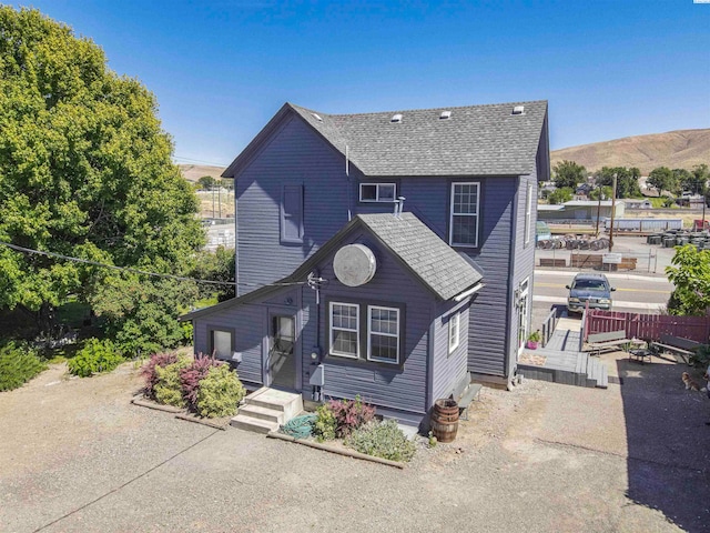 view of front of property with a mountain view