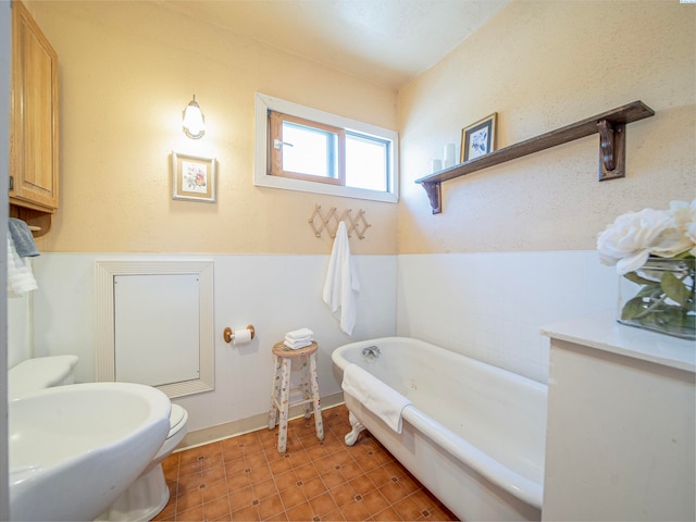 bathroom with a bathing tub and sink