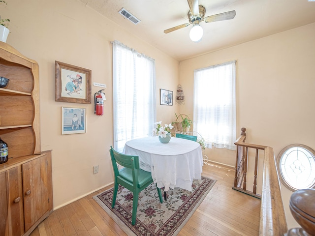 dining space featuring light hardwood / wood-style flooring and ceiling fan