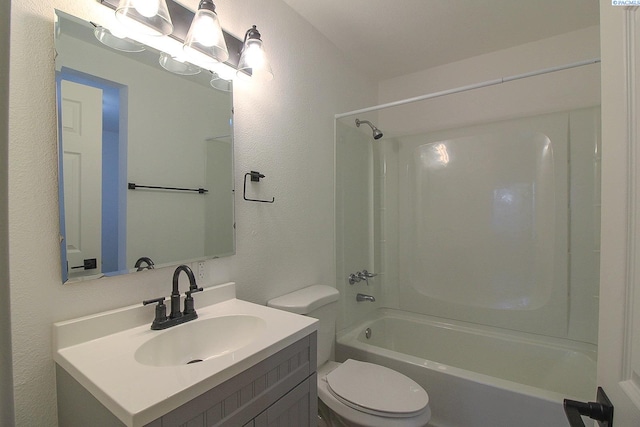 full bathroom featuring shower / bathtub combination, a textured wall, vanity, and toilet