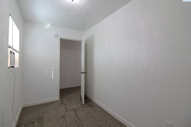 hall with baseboards and carpet flooring