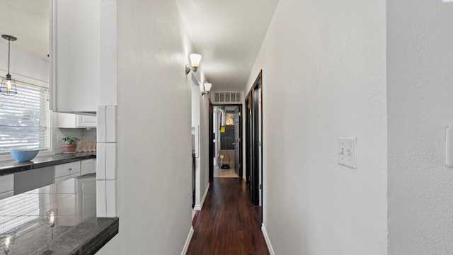 2404 Camden St, Richland, WA 99352 - corridor with baseboards and dark wood-type flooring