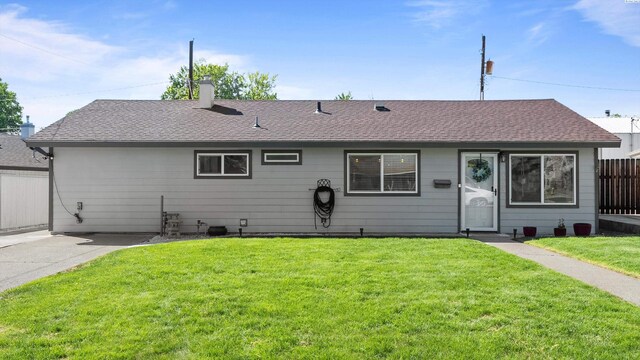 2404 Camden St, Richland, WA 99352 - rear view of house featuring roof with shingles and a chimney