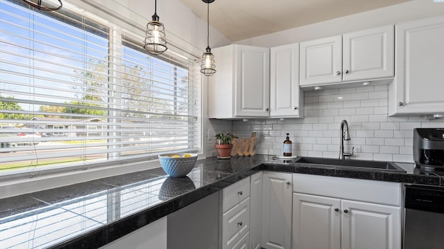 2404 Camden St, Richland, WA 99352 - kitchen with a sink, stainless steel dishwasher, white cabinets, and decorative backsplash