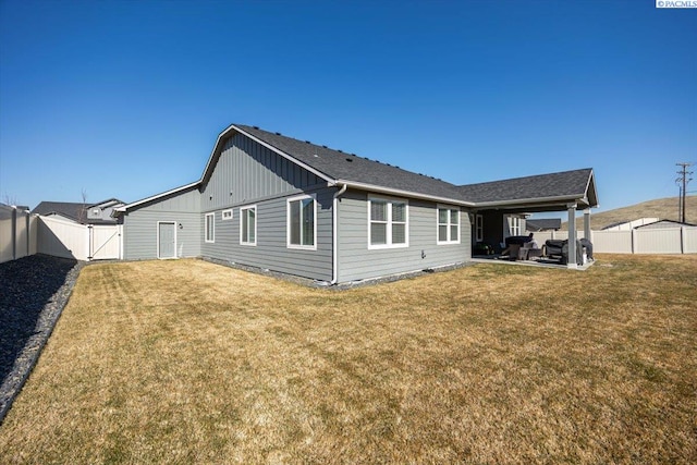234 Ladera St, Prosser, WA 99350 - rear view of house featuring a yard, a patio area, a fenced backyard, and a gate