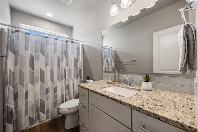 234 Ladera St, Prosser, WA 99350 - bathroom featuring toilet, a shower with curtain, wood finished floors, and vanity