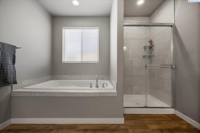 234 Ladera St, Prosser, WA 99350 - bathroom with recessed lighting, wood finished floors, baseboards, a shower stall, and a bath