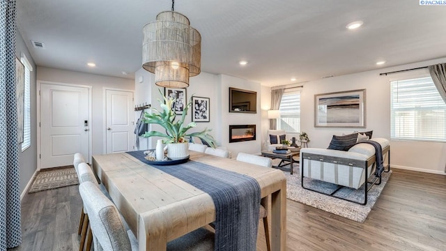 643 S Zeelar St, Kennewick, WA 99336 - dining area featuring wood finished floors, a glass covered fireplace, and recessed lighting