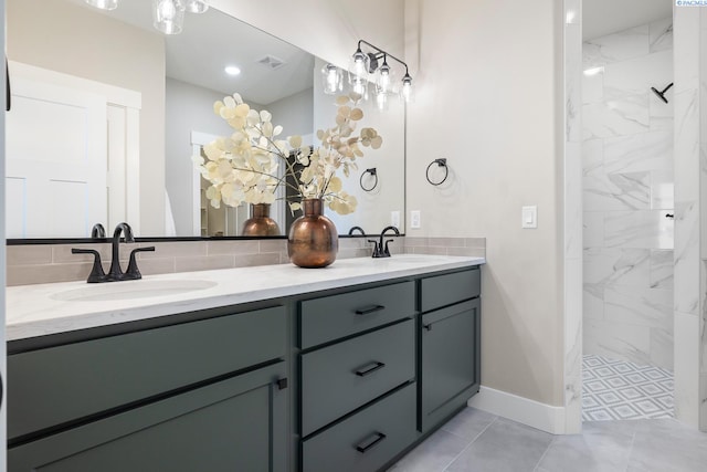 7080 W 34th Pl, Kennewick, WA 99338 - full bath featuring double vanity, a tile shower, baseboards, and tasteful backsplash