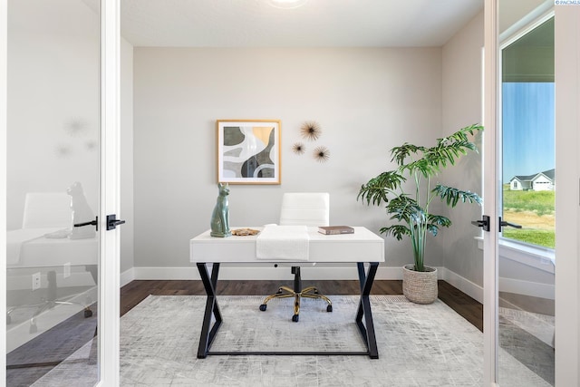 7080 W 34th Pl, Kennewick, WA 99338 - home office with french doors, wood finished floors, and baseboards