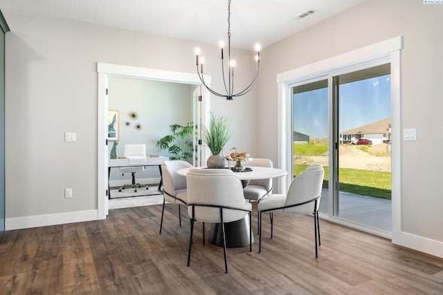 7080 W 34th Pl, Kennewick, WA 99338 - dining area with a chandelier, wood finished floors, baseboards, and an office area