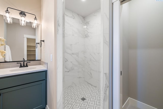 7080 W 34th Pl, Kennewick, WA 99338 - bathroom featuring a shower stall, vanity, and baseboards