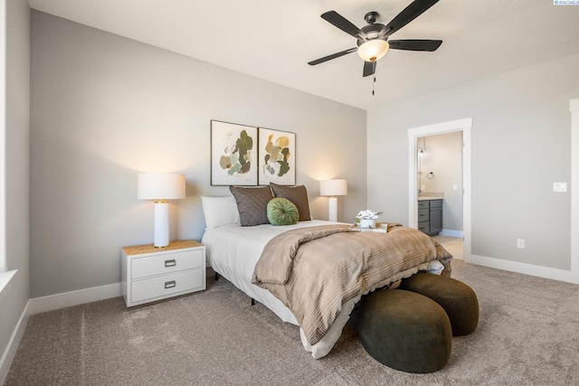 7080 W 34th Pl, Kennewick, WA 99338 - bedroom with light carpet, baseboards, ensuite bath, and a ceiling fan