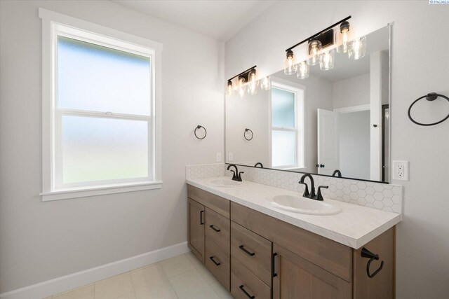 7136 W 28th Pl, Kennewick, WA 99338 - full bathroom with double vanity, tasteful backsplash, and tile patterned flooring