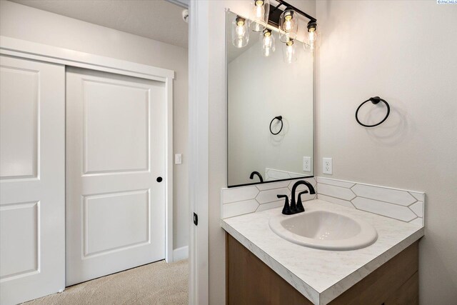 7136 W 28th Pl, Kennewick, WA 99338 - bathroom with vanity and decorative backsplash